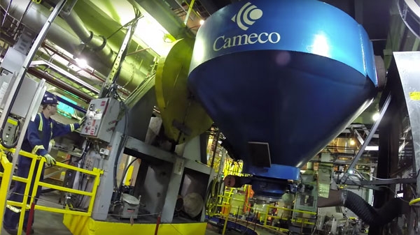 Cameco employee using machinery